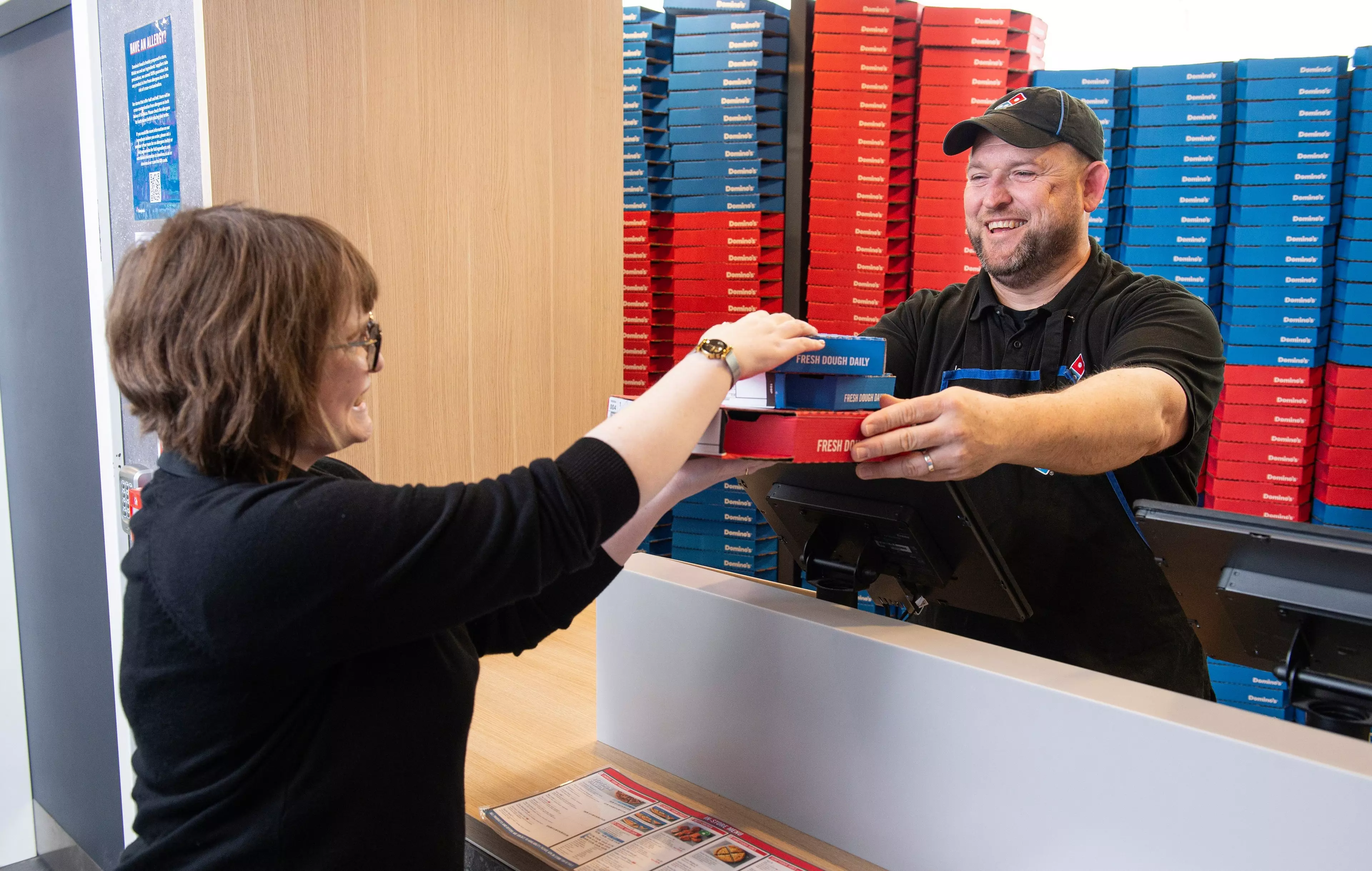 Two woman domino's employees enjoying their job