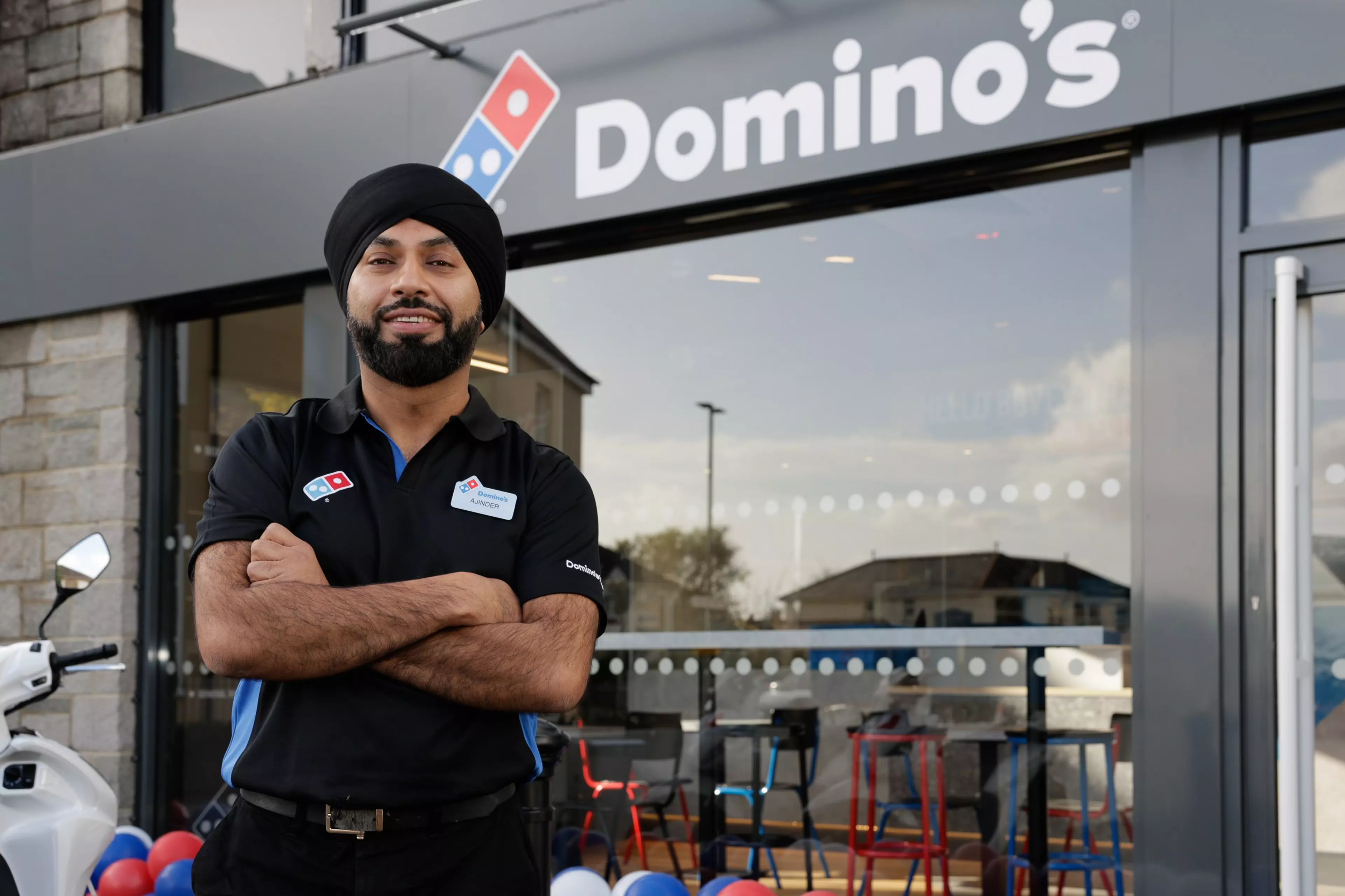 Dominos logo in head office, delivering a better future