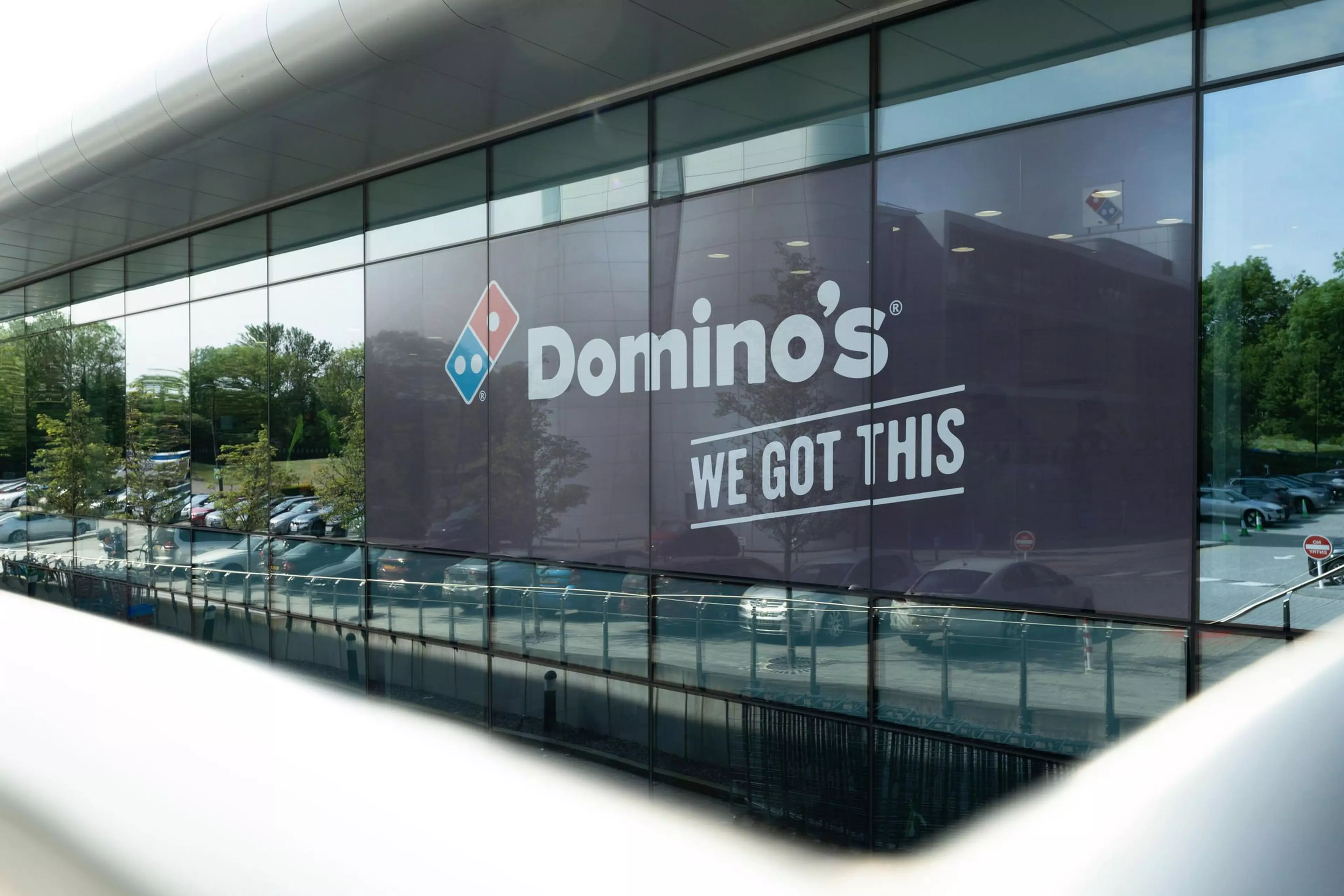 Dominos staff looking at computer