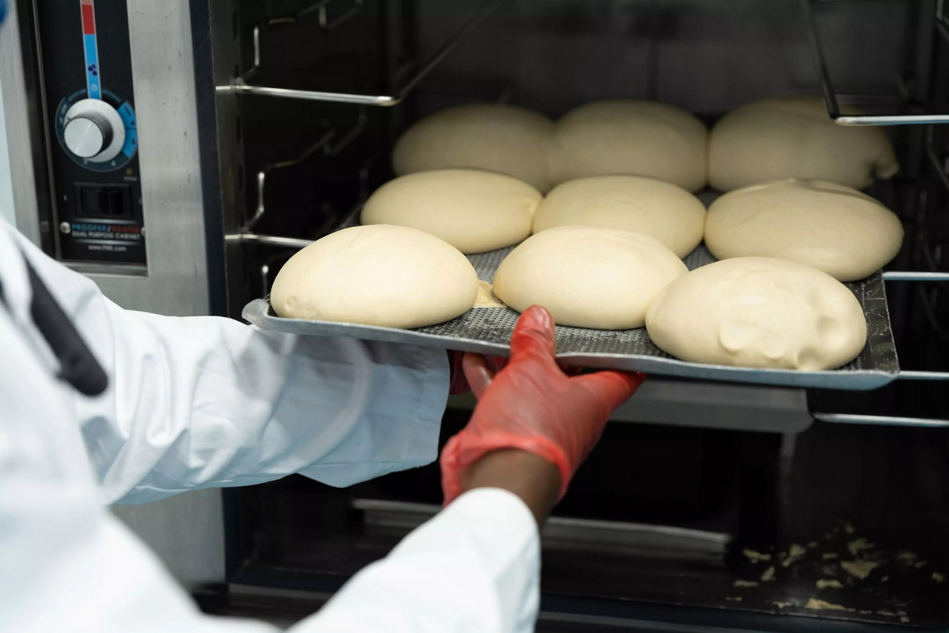 Pizza dough being made