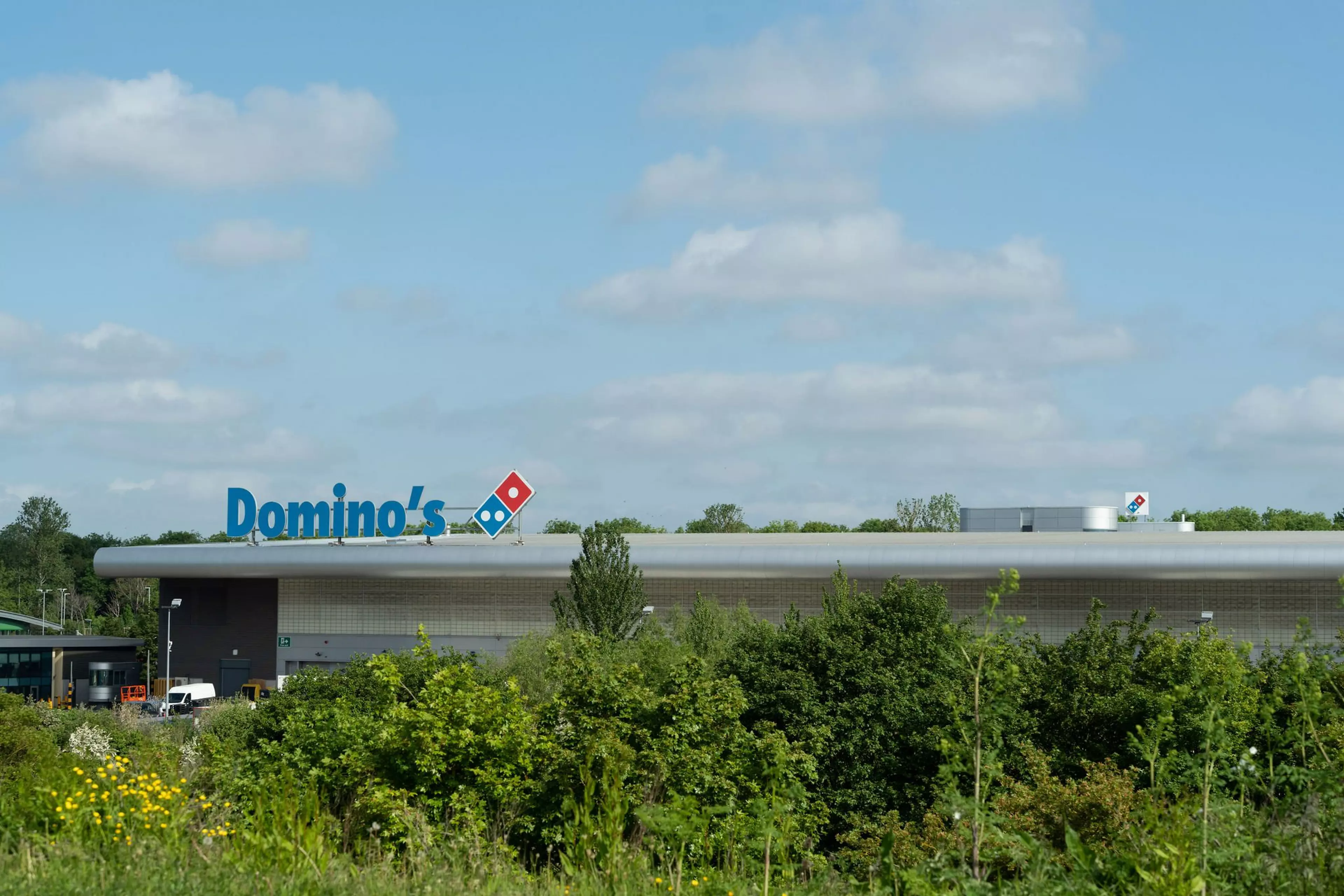 Dominos HQ sign